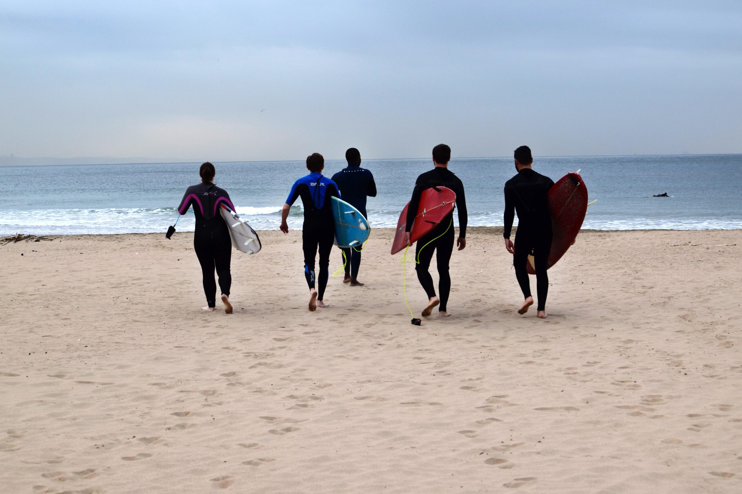 The team heads out for a group surf lesson in Durban, South Africa.