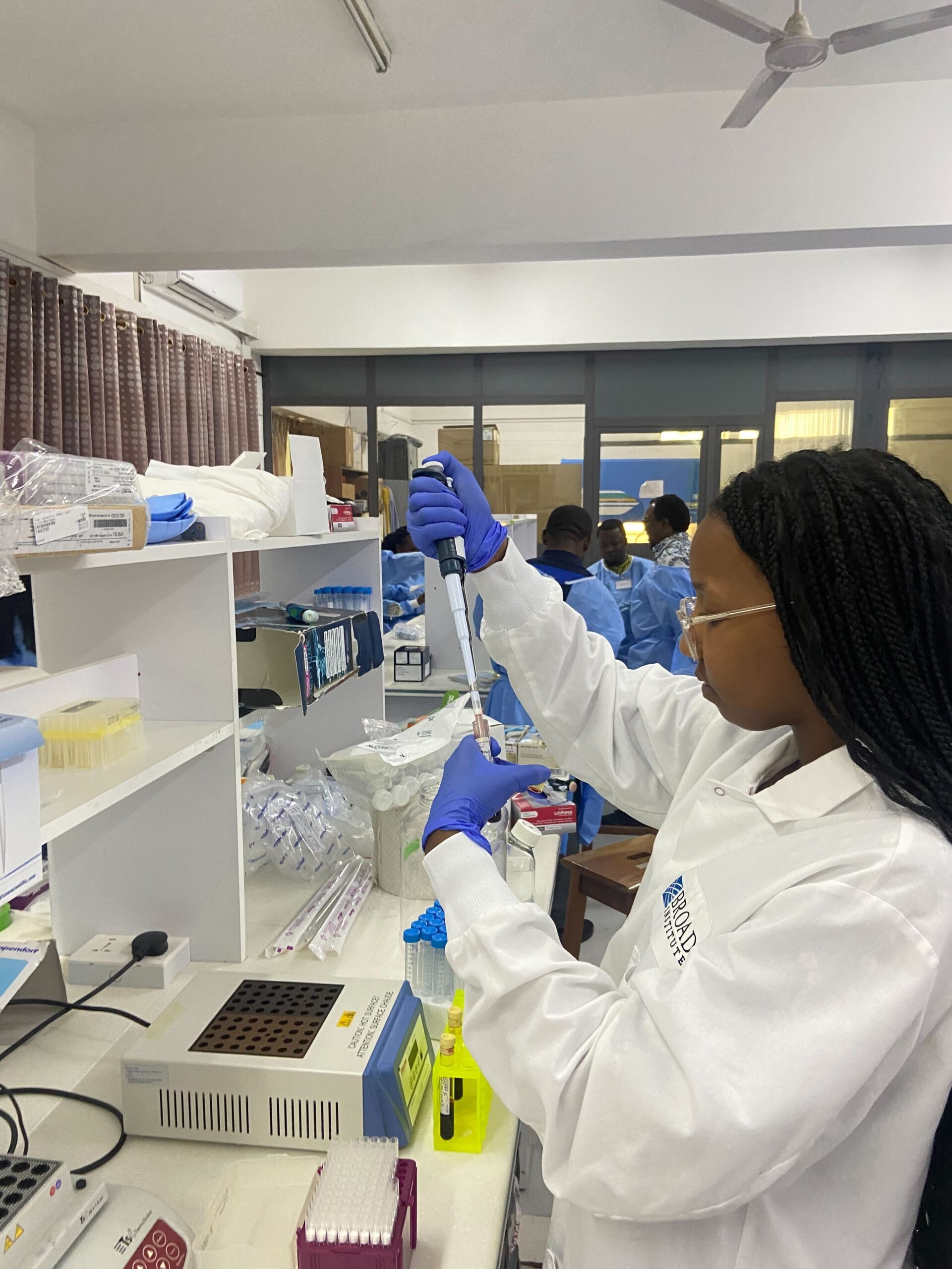 Sarah demonstrating the lab's approach to the science and sequencing that can be done anywhere in the world; here, in Accra, Ghana, 2023.